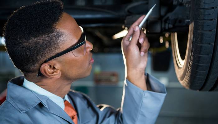 Mechanic repairing a car at repair garage